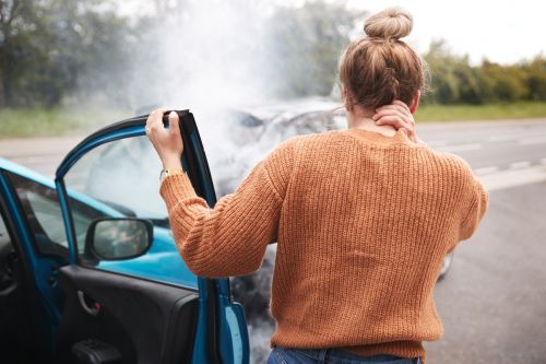 Female Motorist suffering from a car accident injury